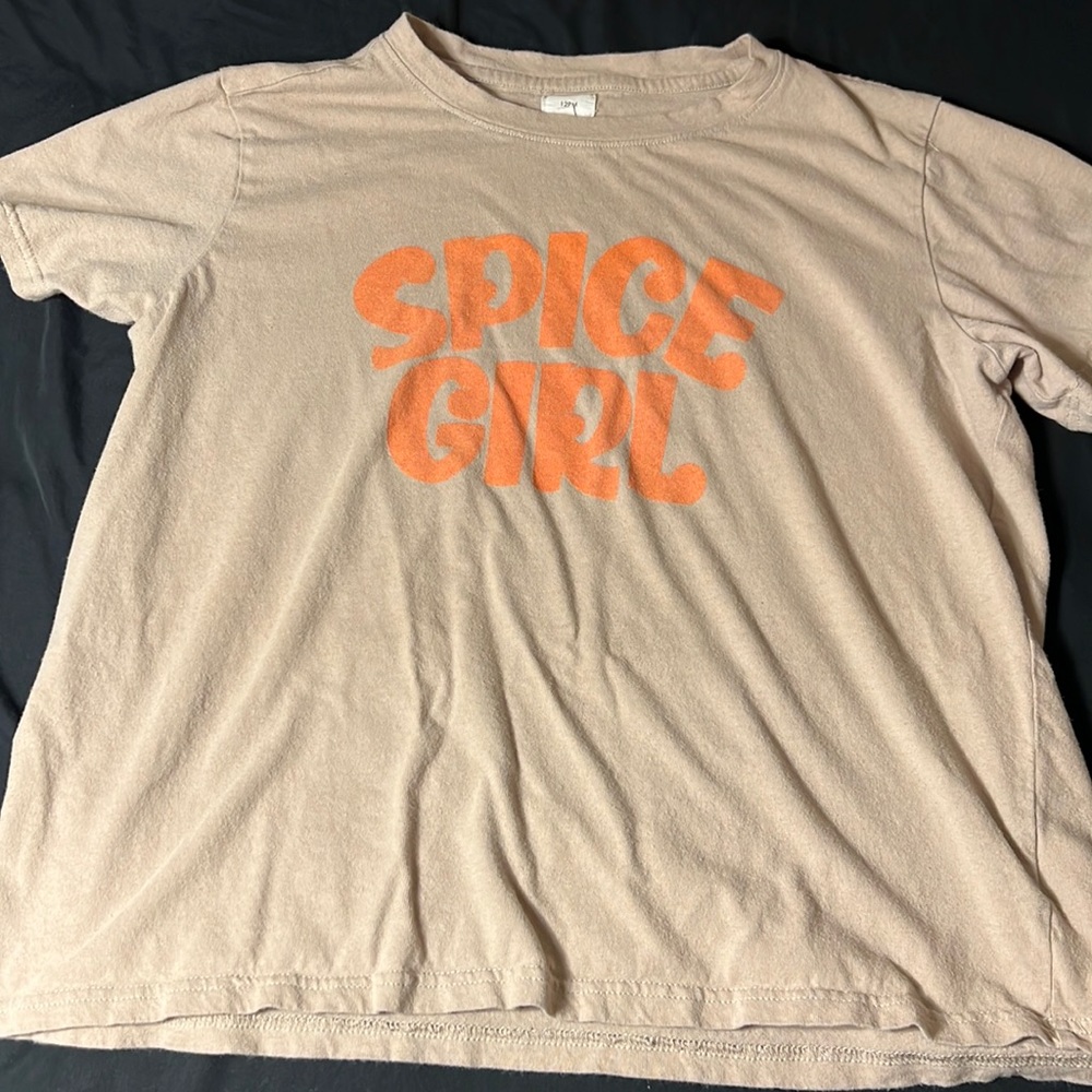 A tan spice girl shirt.